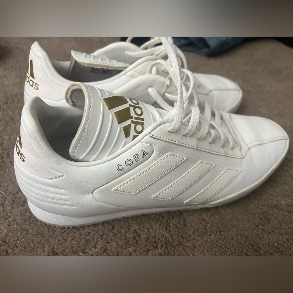 Like new white Adidas Copa. Men’s size 9. Like new.